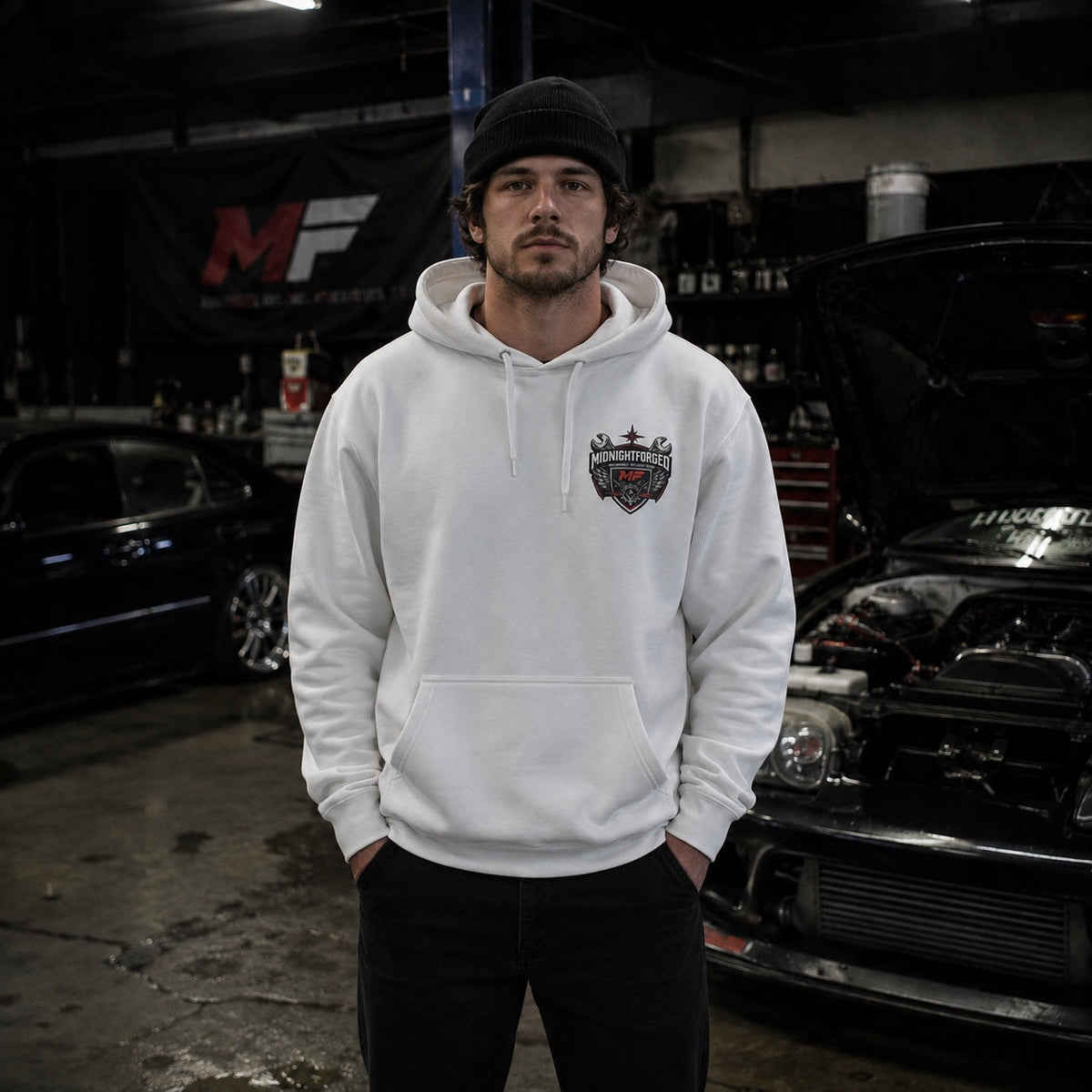 Midnight Forged white hoodie front view worn in performance garage