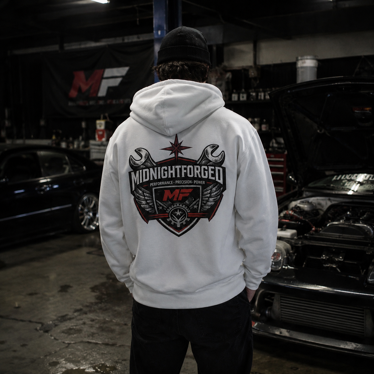 Midnight Forged white hoodie lifestyle photo in automotive garage
